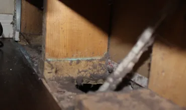 Duct opening full of debris before cleaning