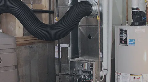 Hypervac Revolution hybrid duct vacuum hose connected to a furnace