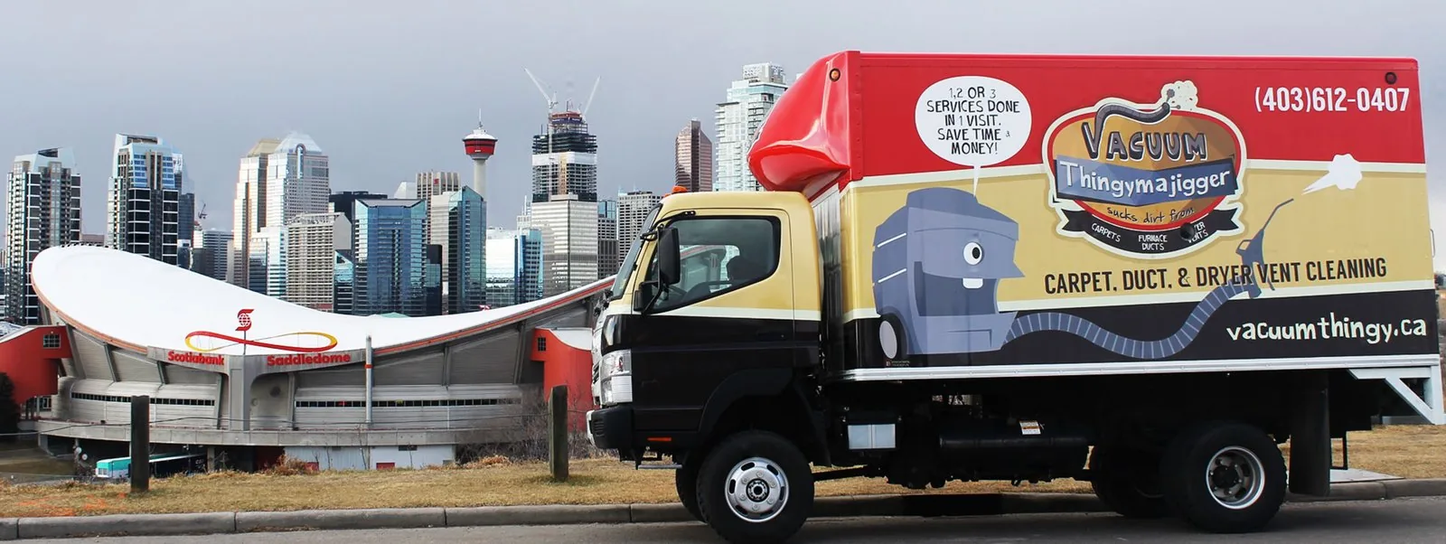 The Vacuum Thingymajigger truck in front of the Calgary skyline